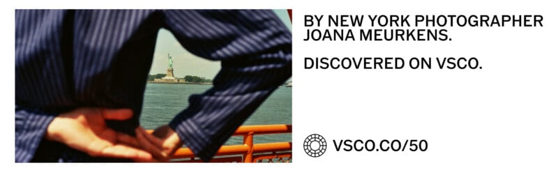A person in a striped shirt frames the Statue of Liberty with their arms, next to text crediting photographer Joana Meurkens.