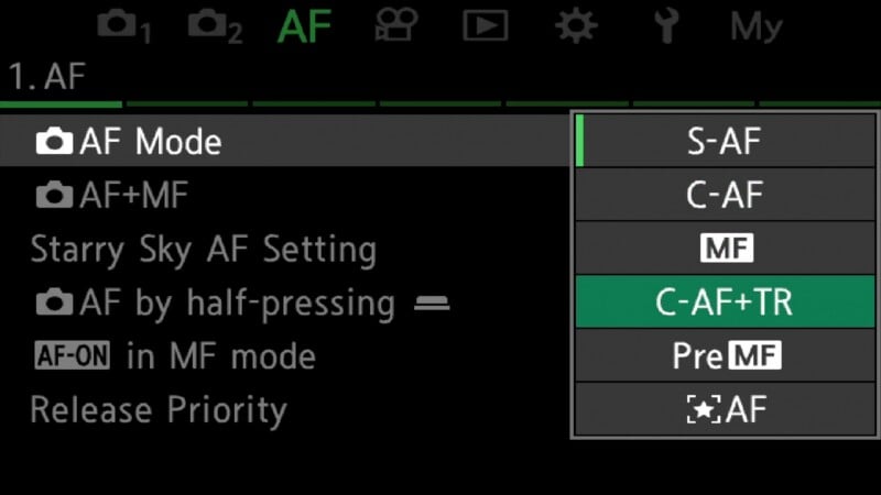 A digital camera menu screen displays the AF (autofocus) settings, with the C-AF+TR option highlighted in a green box within a vertical list.