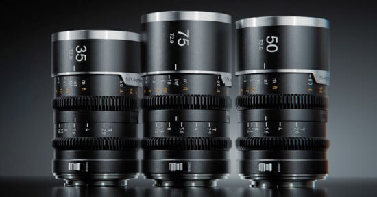 Three black cinema lenses stand side-by-side on a dark surface, labeled with focal lengths of 35, 75, and 50.