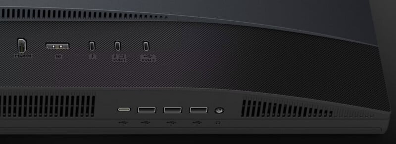 A close-up view of the back panel of a monitor showing various ports, including HDMI, DisplayPort, USB-C, and headphone jacks.