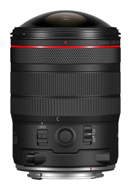 A black Canon RF lens with a prominent, rounded front element, a red ring near the top, and focus and control rings, shown against a white background.
