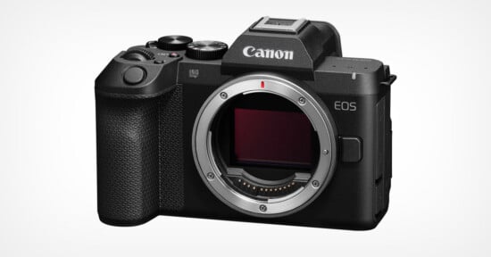 A black Canon EOS R8 Mark II mirrorless camera body shown from the front, featuring a lens mount, a textured grip, and a mode dial on top.