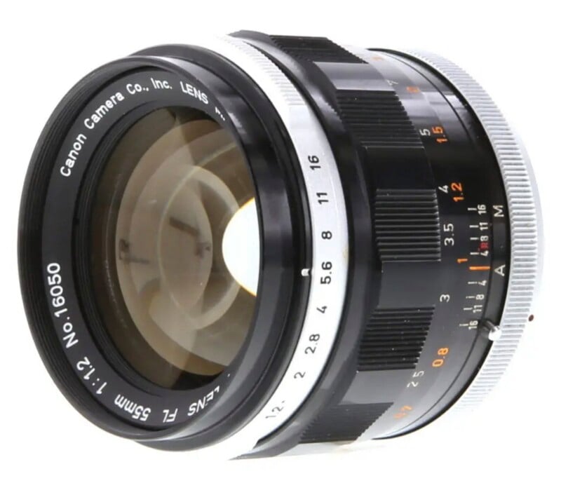 A Canon FL 55mm f/1.2 camera lens shown from a side angle against a white background.