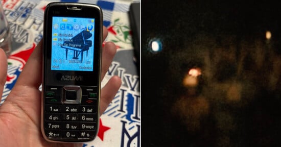 A split-screen view shows a hand holding an Azumi T101 mobile phone on the left and a dark, blurry night sky with several glowing lights on the right.