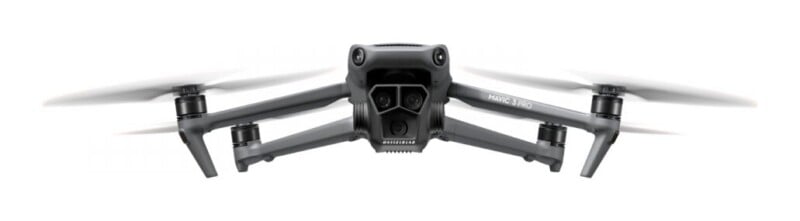 A front-facing view of a grey DJI Mavic 3 Pro drone with its triple-camera gimbal system visible.