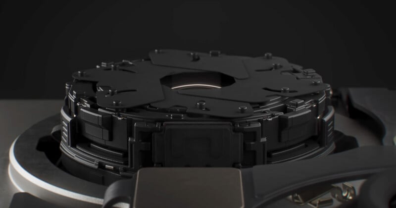 A close-up view of a mechanical camera aperture mechanism with overlapping black blades centered within a circular housing.
