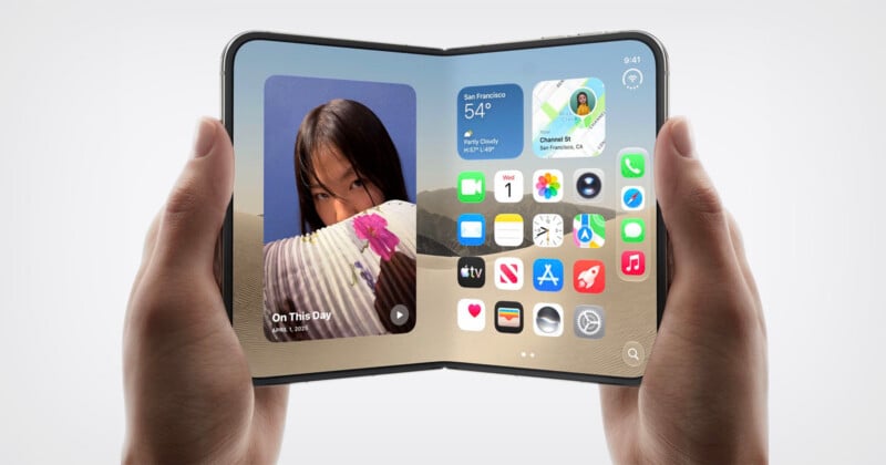 A person holds a foldable smartphone displaying an iOS-style home screen with widgets and app icons against a desert background.