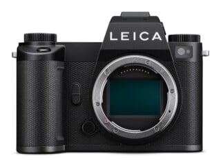 A front-facing black Leica mirrorless camera body with an exposed sensor and lens mount.