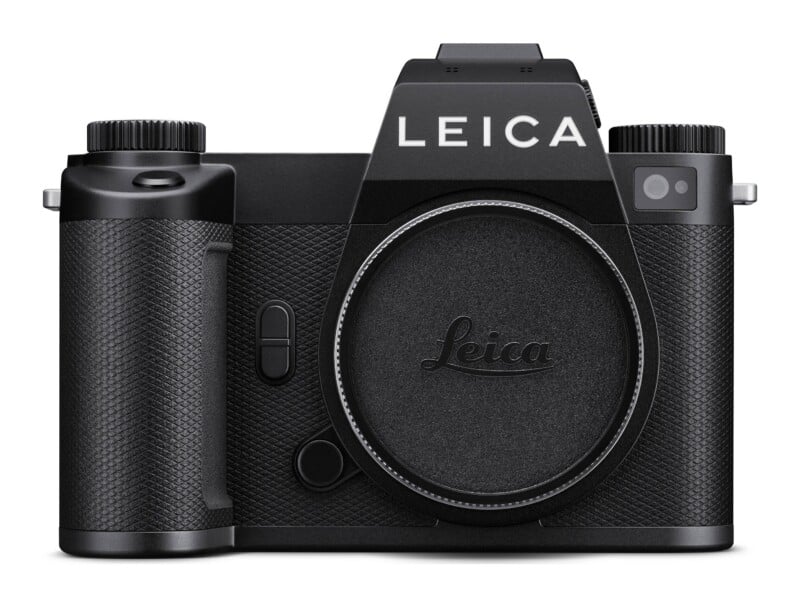 A black Leica mirrorless camera body with a lens cap attached, viewed from the front.