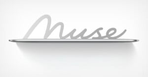 A silver-colored floating shelf against a white wall features the word "Muse" in a cursive, metallic script as its back support.