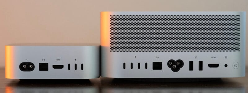 The rear panels of a Mac mini and a Mac Studio are shown side-by-side, displaying their respective power, data, and video ports.