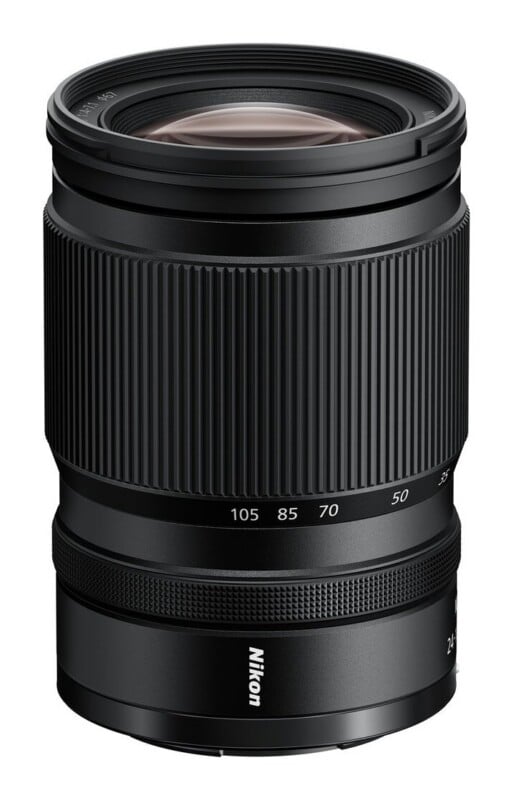 A black Nikon camera zoom lens stands upright against a white background, showing focal length markings from 35 to 105 mm.