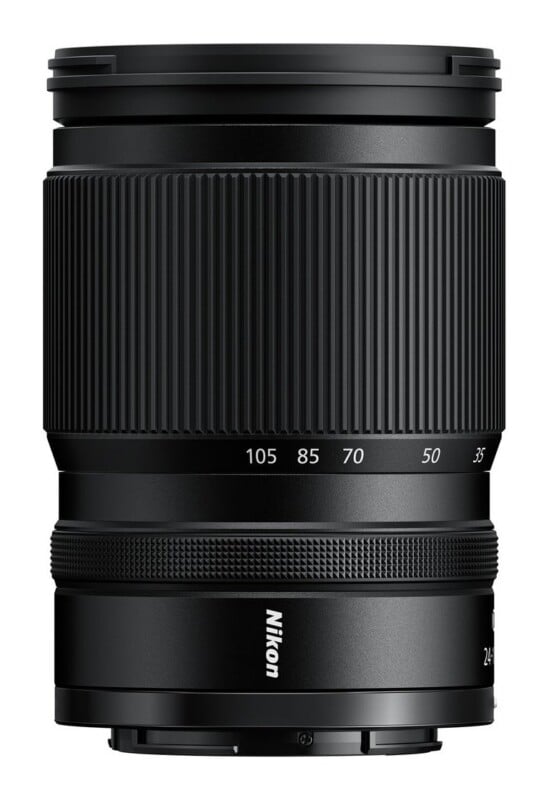 A black Nikon camera zoom lens stands vertically against a white background, showing focal length markings from 35 to 105.