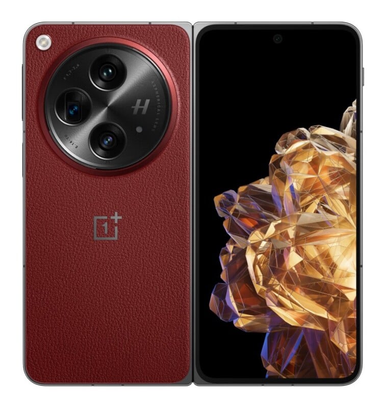 A red, leather-textured foldable smartphone shown from both the back and front, featuring a large circular camera module and a vibrant, abstract gold-toned display.