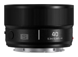A black camera lens with a ribbed focus ring, featuring the text "40" and "0.3m/0.98ft-∞" printed on the side, with a silver metal mount at the base.