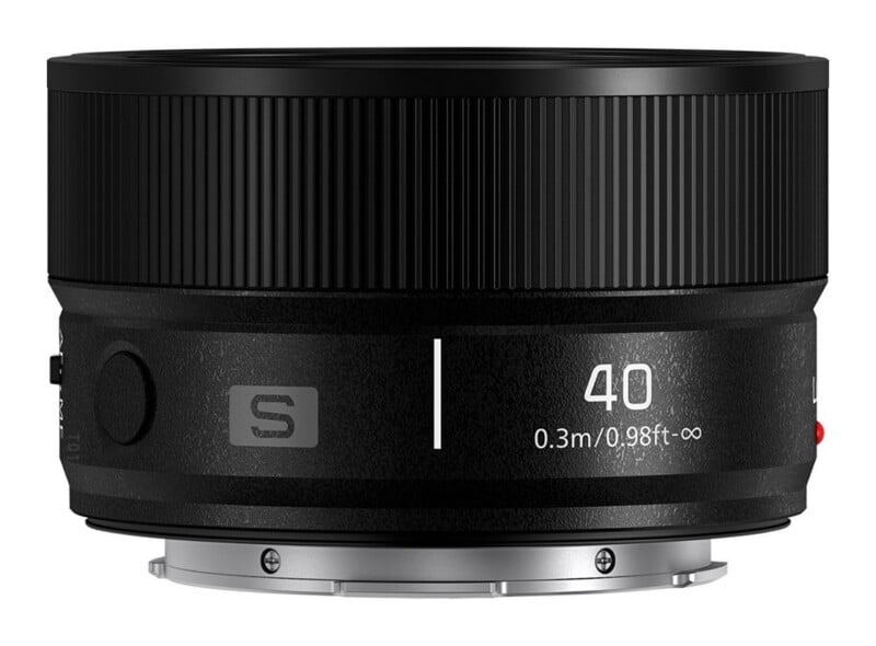 A black camera lens with a ribbed focus ring, featuring the text "40" and "0.3m/0.98ft-∞" printed on the side, with a silver metal mount at the base.