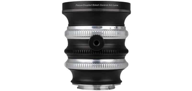 A black and silver camera lens with a focus ring, a bokeh control ring, and the text "Focus-Coupled Bokeh Control Art Lens" printed on the top.