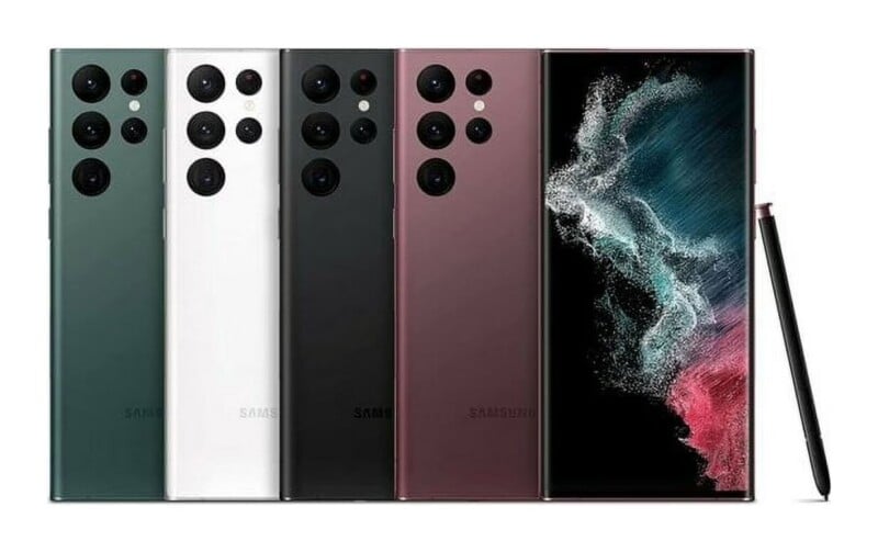 Four smartphones in green, white, black, and burgundy are lined up next to a front-facing phone and a stylus.