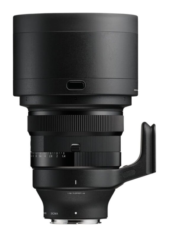 A black camera lens with a large hood, a focus ring, an aperture ring marked from 1.4 to 16, and a tripod mount collar.