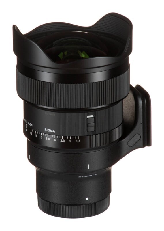 A black camera lens with a wide-angle front element, a manual aperture ring marked from 1.4 to 16, and a focus distance scale, shown against a white background.