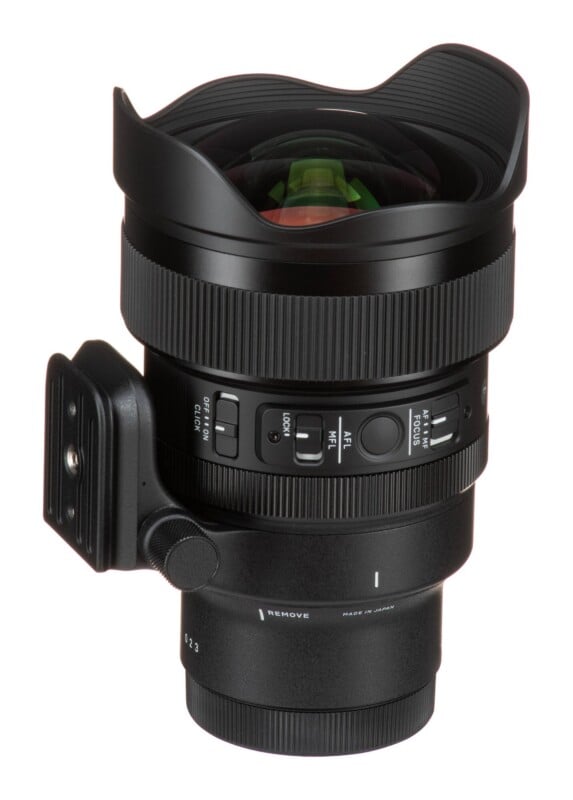 A black wide-angle camera lens with a built-in lens hood, featuring focus and click switches on the side and a tripod mount attached to the barrel.