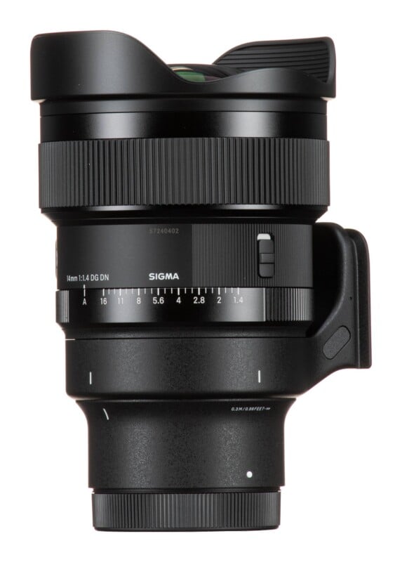 A black Sigma 14mm 1:1.4 DG DN camera lens shown from the side against a white background.