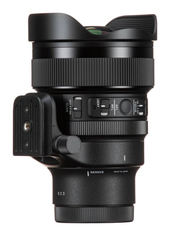 A black camera lens shown from the side, featuring a tripod mount, focus and aperture switches, and a "MADE IN JAPAN" label.