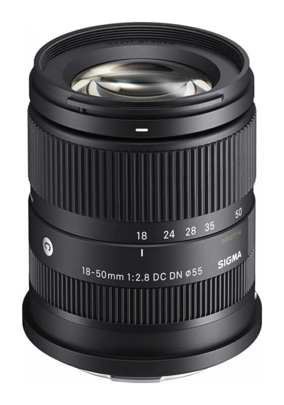 A black Sigma 18-50mm f/2.8 DC DN zoom lens for mirrorless cameras, shown from a front-facing perspective.