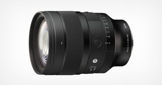 A black Sigma 85mm f/1.2 DG lens viewed from the side, featuring a focus ring, aperture ring, and an autofocus switch against a white background.