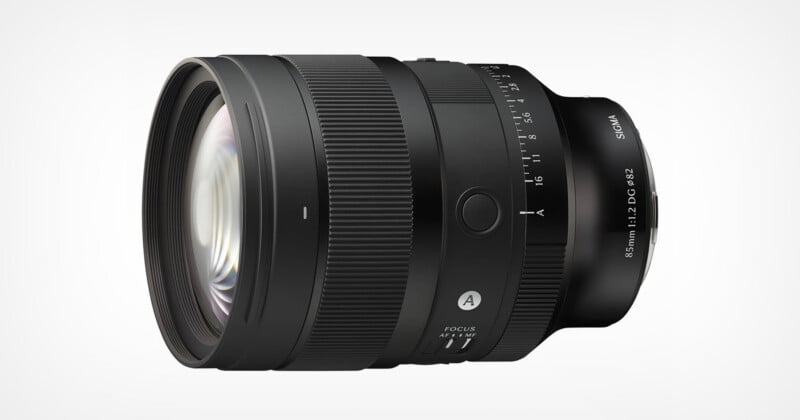 A black Sigma 85mm f/1.2 DG lens viewed from the side, featuring a focus ring, aperture ring, and an autofocus switch against a white background.
