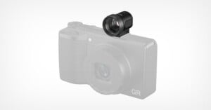 A black external optical viewfinder is mounted on the hot shoe of a light gray Ricoh GR digital camera.