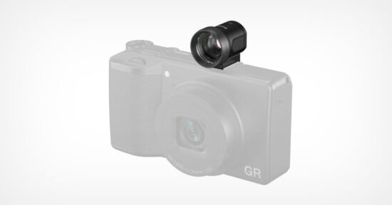 A black external optical viewfinder is mounted on the hot shoe of a light gray Ricoh GR digital camera.