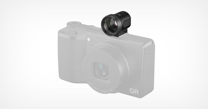 A black external optical viewfinder is mounted on the hot shoe of a light gray Ricoh GR digital camera.