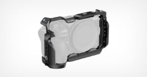 A black metal camera cage by SmallRig is mounted around a Nikon Z-series camera body against a plain white background.