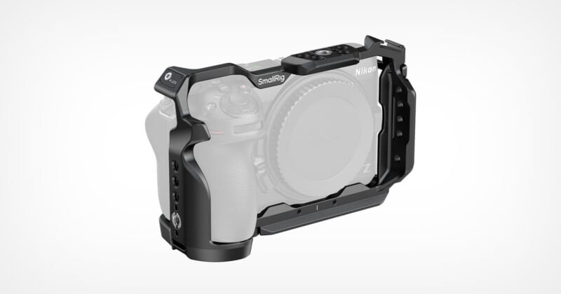 A black metal camera cage by SmallRig is mounted around a Nikon Z-series camera body against a plain white background.