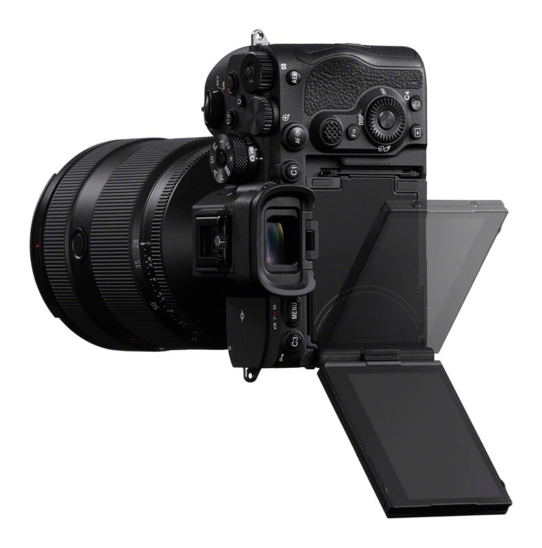 A black mirrorless camera with an attached lens is shown from the rear, featuring an articulated LCD screen tilted outward and a prominent electronic viewfinder.
