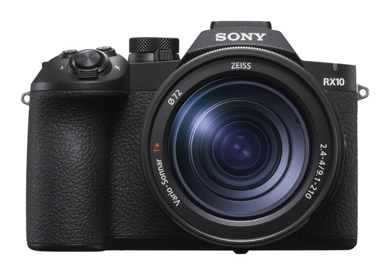 A black Sony RX10 digital camera with a large Zeiss Vario-Sonnar T* lens facing forward against a white background.