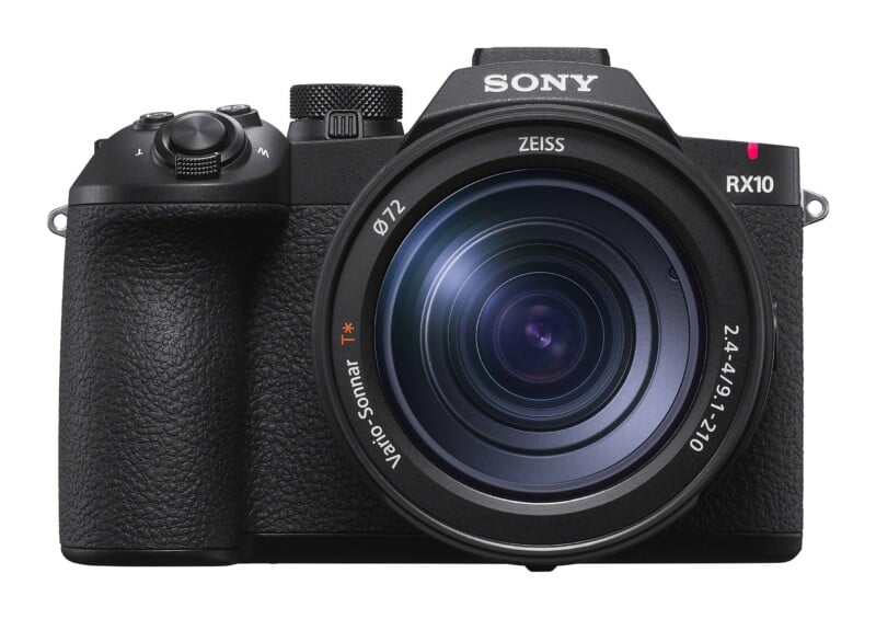 A front-facing Sony RX10 digital camera with a large Zeiss Vario-Sonnar T* lens, featuring a 72mm filter thread and a black textured grip.