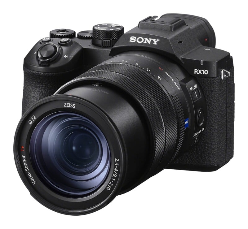 A black Sony RX10 digital bridge camera with a large Zeiss Vario-Sonnar lens, viewed from a front-facing angle against a white background.