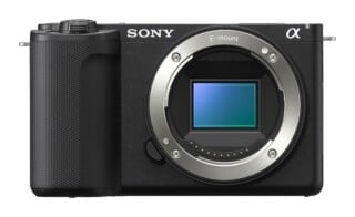 A front view of a black mirrorless camera body with a silver E-mount lens ring and an exposed rectangular image sensor.