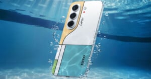 A Tecno Camon smartphone with a multi-colored geometric back panel floats underwater surrounded by rising air bubbles.