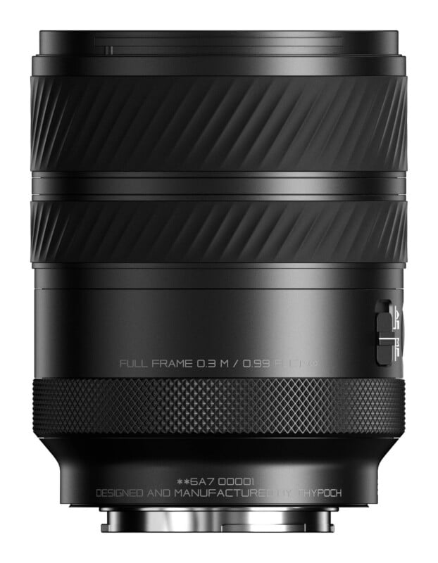A black camera lens stands vertically, featuring a textured focus ring, an AF/MF switch, and the text "DESIGNED AND MANUFACTURED BY THYPOCH" at the base.