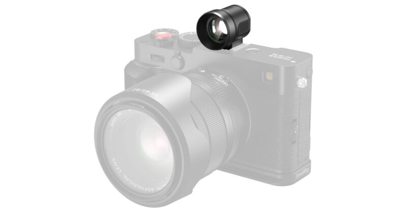 A black optical viewfinder accessory is mounted to the hot shoe of a Fujifilm X-E5 camera equipped with a lens.