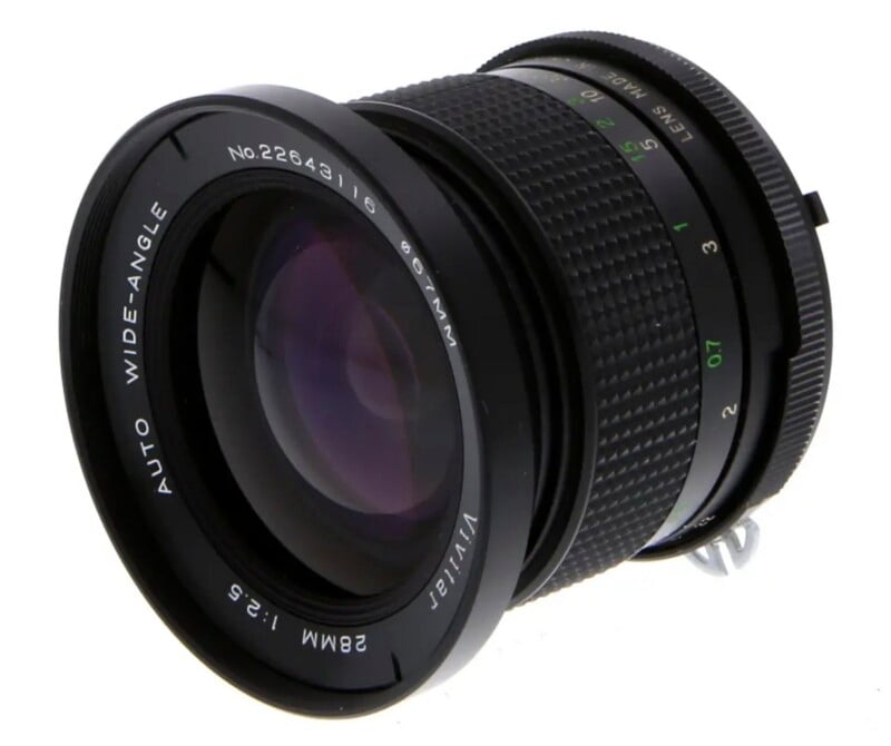 A Vivitar 28mm f/2.5 wide-angle camera lens with a 67mm filter thread, shown from a front-angled perspective.