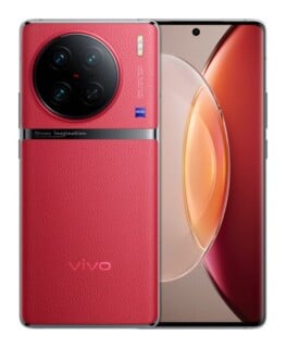 A red, leather-textured smartphone shown from the back and front, featuring a large circular camera module with ZEISS branding and a curved display.