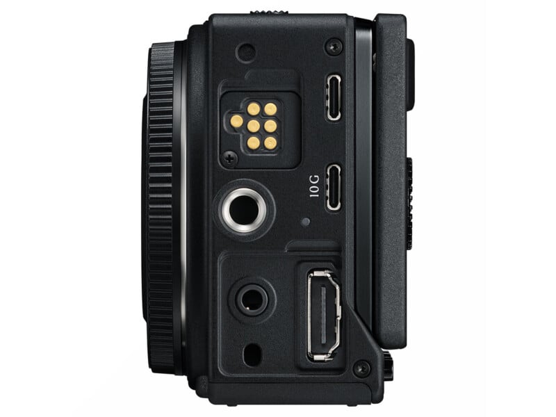 Side view of a camera body showing a lens mount, a gold contact pin array, a 10G USB-C port, a tripod mount, a 3.5mm jack, and an HDMI port.