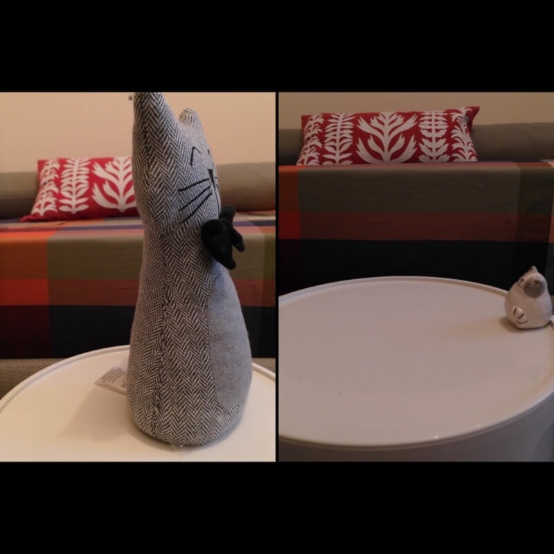 A split-screen view shows a grey fabric cat doorstop on a white table on the left, and a small ceramic cat figurine on the same table on the right.