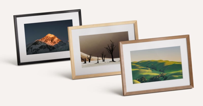Three framed landscape photographs displayed at an angle, featuring a mountain peak, dead trees in a desert, and rolling green hills.
