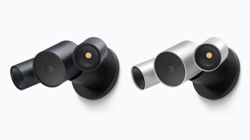 Two wall-mounted security cameras, one black and one silver, are shown side-by-side against a white background.