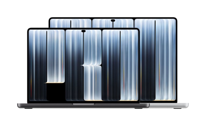 Two open laptops are layered, one in space gray in the foreground and one in silver in the background, both displaying a vertical abstract blue and white light-streaked wallpaper.